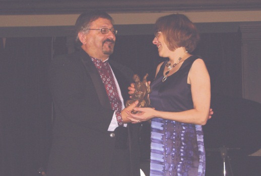 4 - Shevchenko Foundation President Andrew Hladyshevsky presents the 2012 Kobzar Literary Award to Shandi Mitchell for her novel Under This Unbroken Sky