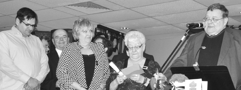 James Slobodian (right) giving acceptance speech, with members of the Spirit Lake Corporation board of directors standing on the left