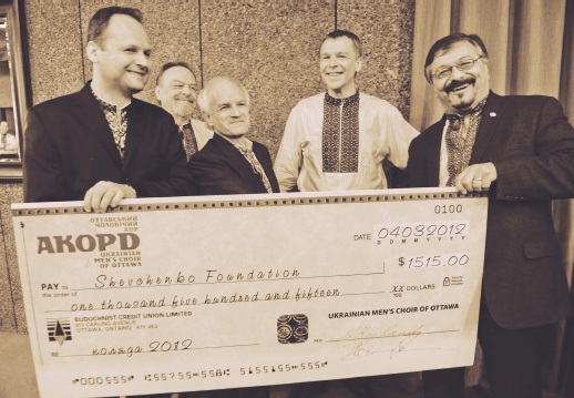 2 - AKORD Ukrainian Men’s Choir members presenting koliada cheque to Shevchenko Foundation President Andrew Hladyshevsky