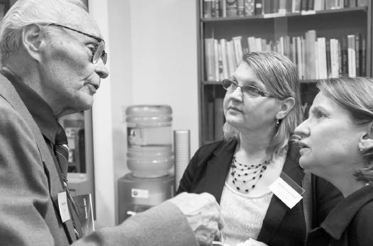 1 -Survivor Mykola Latyshko speaks with participants Natalia Onyschuk (Left) and Oksana Kulynych