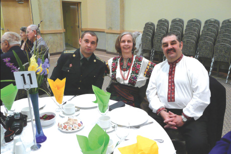 1 - L. to R.: Ukrainian military officer guest, Iris Sopinka Chwaluk and Zenon Chwaluk