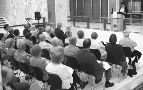 3-      Co-editor Dr. Rhonda Hinther speaks to the audience in atrium at LAC