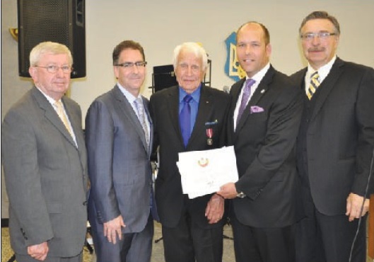 L. to R.: The Hon. Joe Comartin, MP, Deputy Speaker of the House Brian Masse, MP, Medal Recipient Petro Mycak, UCC President Paul Grod, UCC Ontario Prov. Council President Stefan Andrusiak