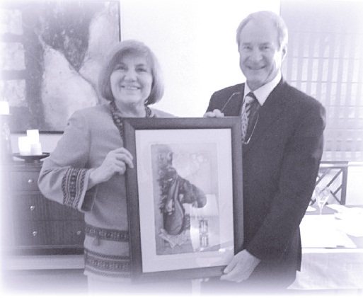 Olya Korzachenko, UNF Ottawa-Gatineau Branch Secretary presents Branch President Paul Migus with a UNF of Canada 80th Anniversary print “Celebrating Our Culture” by artist Larisa Cheladyn Sembaliuk, for his exceptional work in pioneering the PYI Youth Leadership Parliament Educational Forum