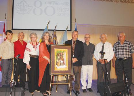 L. to R.: Slawko Borys, UNF Toronto Branch President, Walter Kish, former President UNF Oshawa/Durham Branch, Daria Diakowsky, UNF Executive Secretary, Larisa Sembaliuk Cheladyn, artist with her anniversary painting “Celebrating Our Culture”, Taras Pidzamecky, UNF National President, Bohdan Diakiw, UNF St. Catharines Branch President, Dmytro Bojeczko, UNF Hamilton Branch President, Petro Kowalczyk, UNF Toronto West Branch President