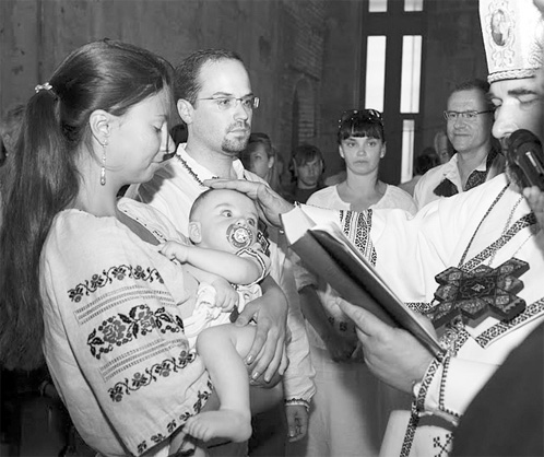 Baptism of  Felix Roman Volodymyr Wrzesnewskyj, held by godparents, with on-looking parents Lina Fedko and Borys Wrzesnewskyj in Kyiv’s Ukrainian Catholic Patriarchal Cathedral of the Resurrection of Christ