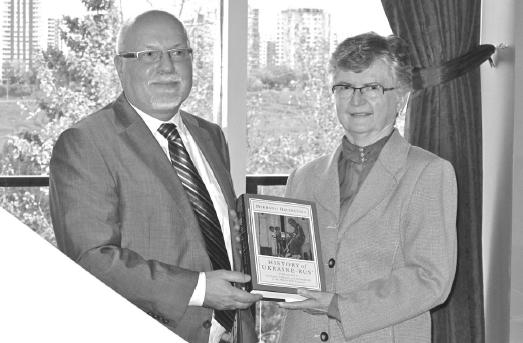 4 - Frank Sysyn presenting the new Hrushevsky volume to Diana Holowaychuk, cousin of the volume’s major sponsor, Jeanette Bayduza