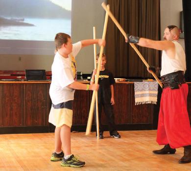 2 - Petro Velynets (right of centre) sparring with Alex (left of centre) in centre background an unnamed boy