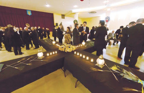 Holodomor commemoration participants at respectfully modest lunch after prayer and remembrance service of Famine Genocide victims in Soviet Ukraine 1932-1933