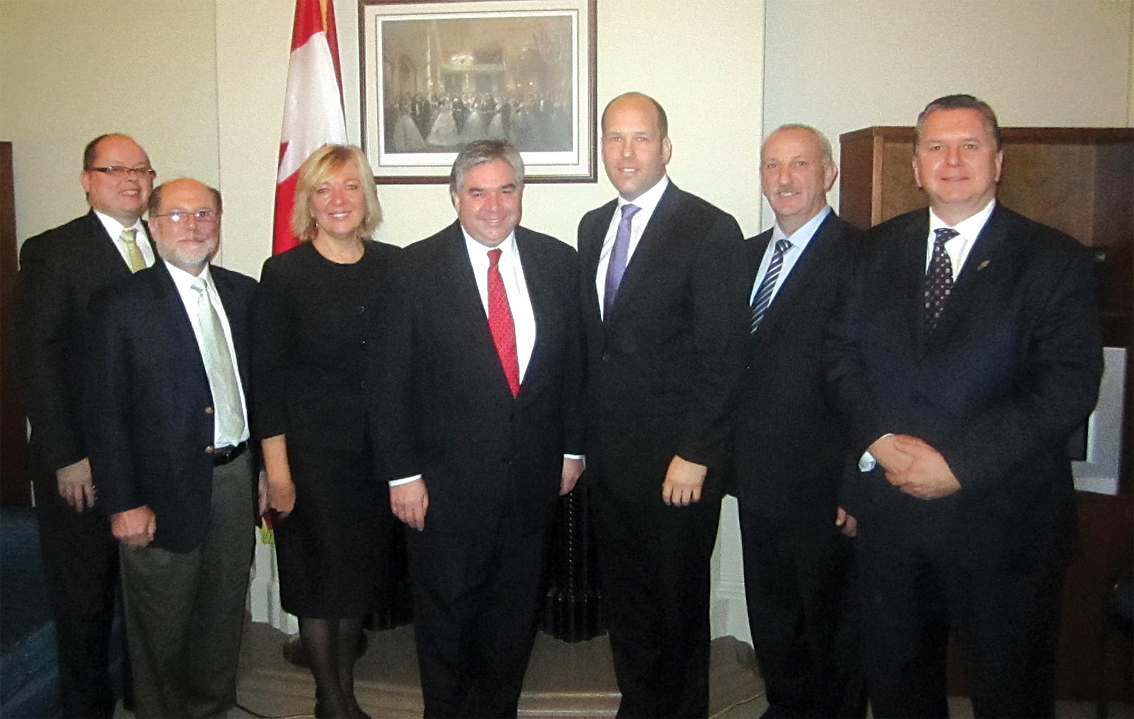 L. to R.: Taras Zalusky, Borys Potapenko, Chrystyna Bidiak, the Hon. Peter Van Loan, Paul Grod, John Iwaniura, and Taras Pidzamecky